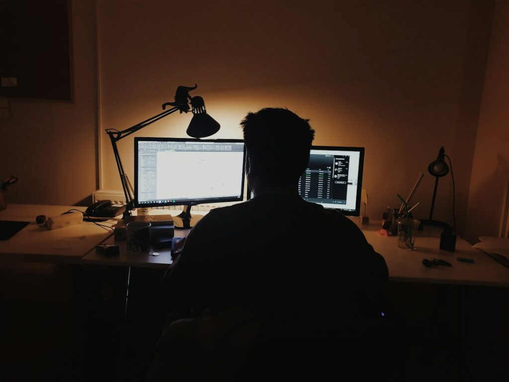 Professional working thoughtfully at a computer