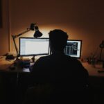 Professional working thoughtfully at a computer