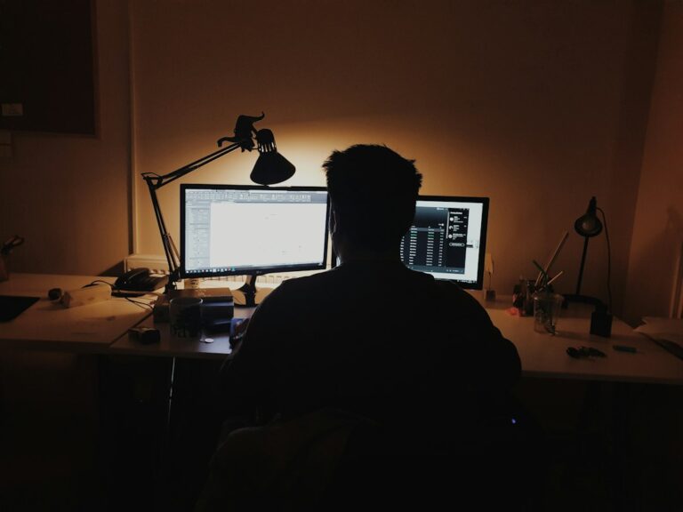 Professional working thoughtfully at a computer