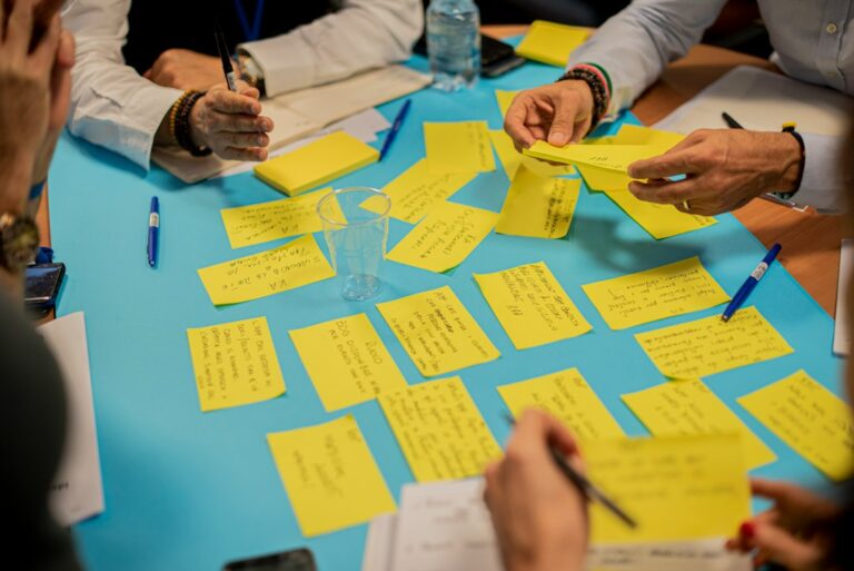 Team workshop using sticky notes to examine a system