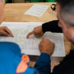 Engineering team reviewing a technical plan during root cause analysis