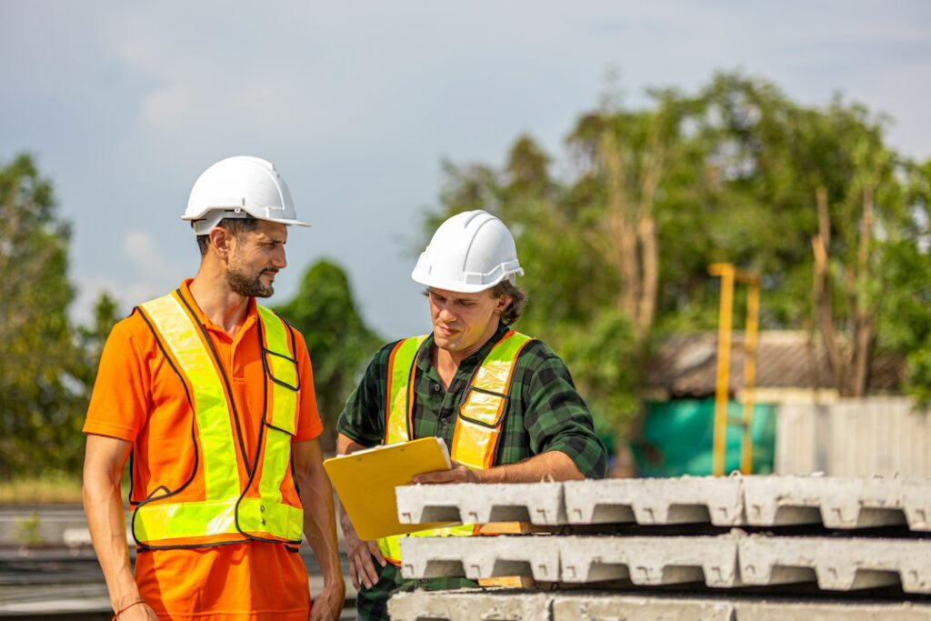 Supervisor and engineer reviewing work together on a factory floor