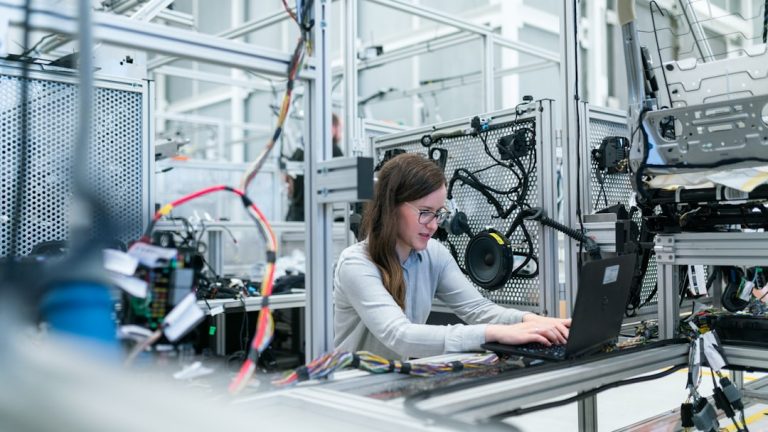 Manufacturing engineer using digital SOP software in 2026